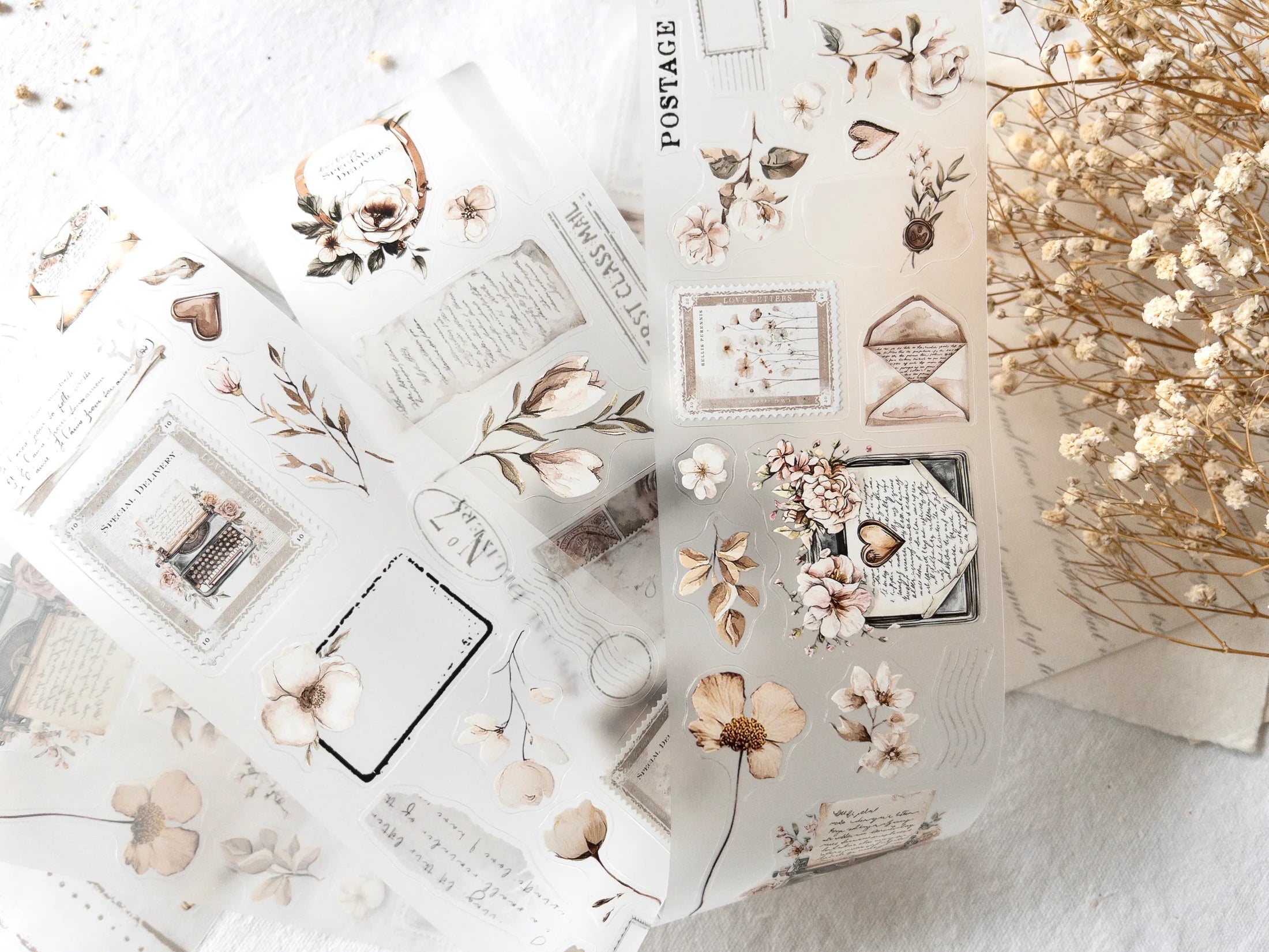 Collection of decorative stickers with floral and vintage designs on a light background.