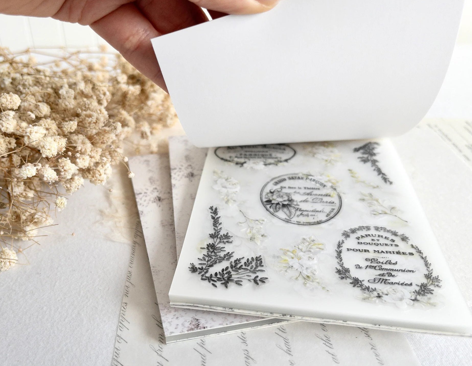 Showing a sticker page in a sticker book, with black text and floral designs