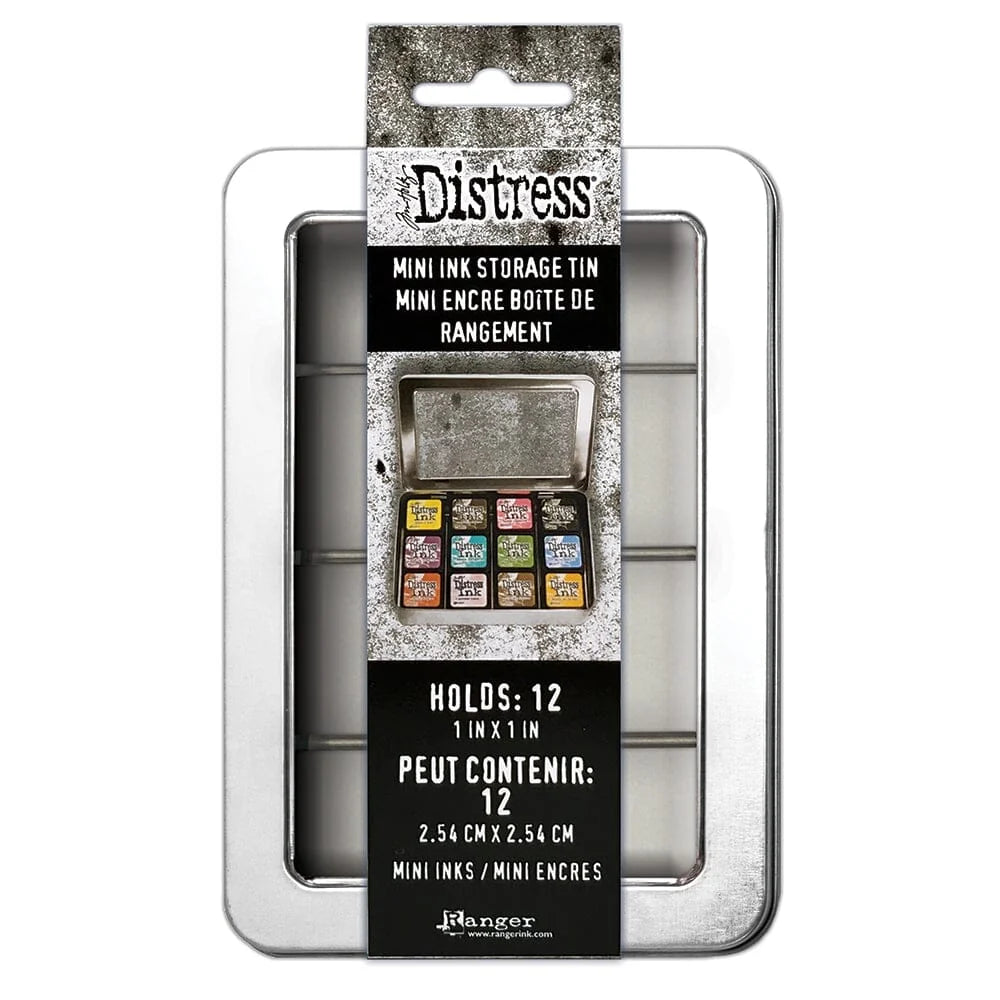 Distress Mini Ink Storage Tin by Ranger, shown in its retail packaging. The product is a silver metal tin with a black and white textured label featuring the Distress brand name and an illustration of the open tin containing 12 colorful mini inks.