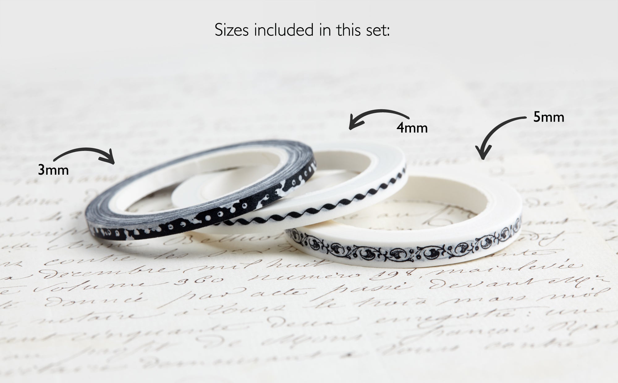 Three rolls of ultra slim washi tape with labeled sizes on a textured surface