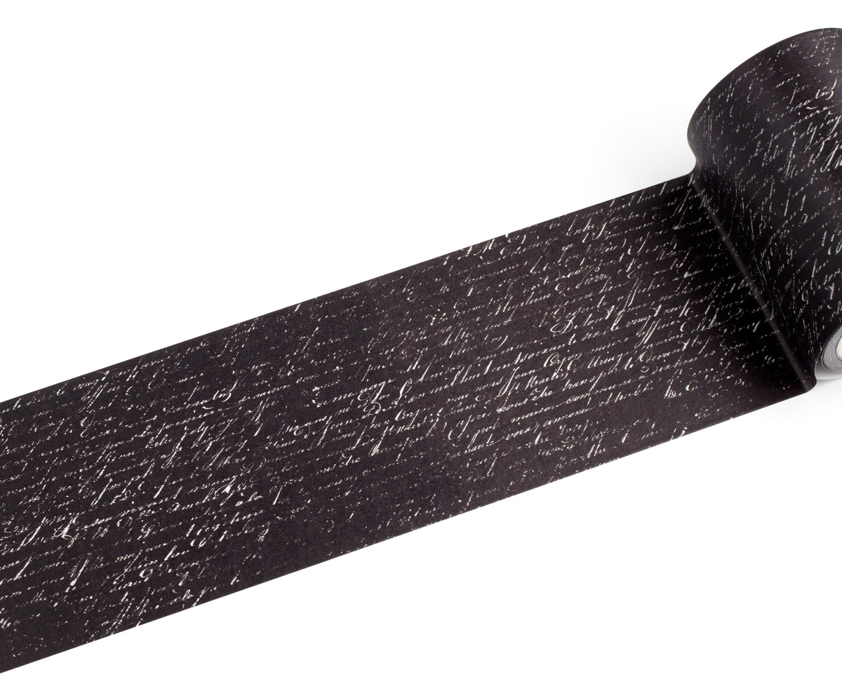 A roll of black tape with a white cursive handwriting, shown partially unrolled on a plain white background.