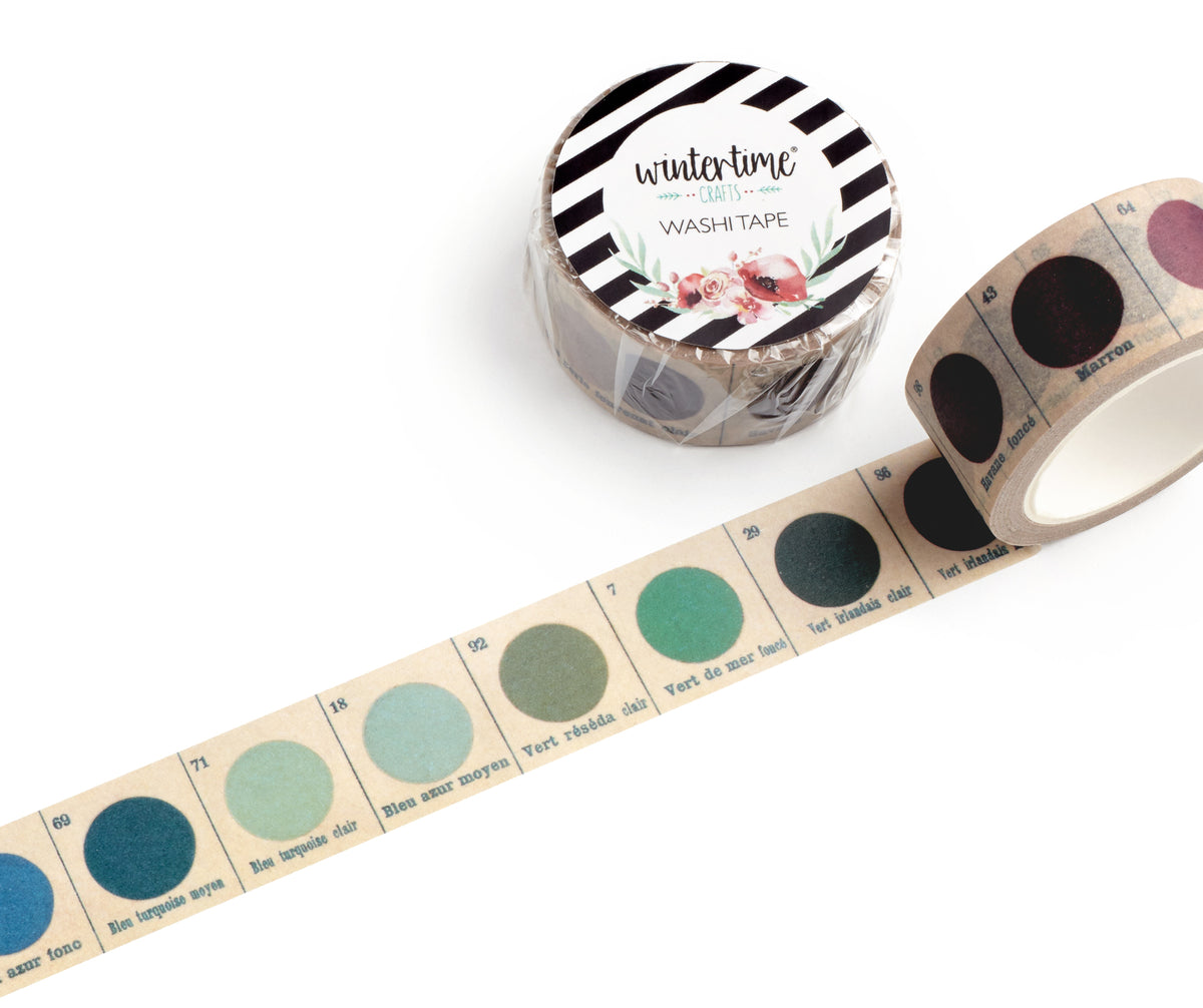A roll of washi tape with showing multiple circular color swatches in shades of blue, green, teal, and purple on a white background.