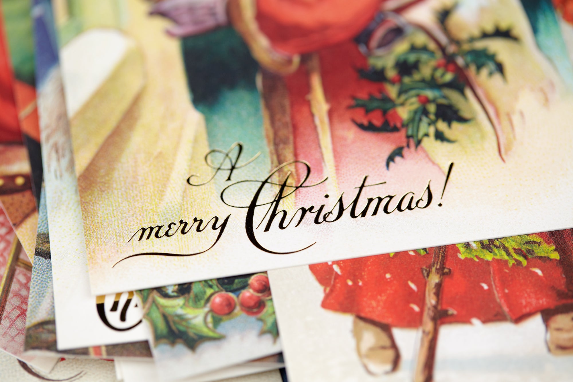 A close-up of a vintage-style Christmas greeting card with the words &