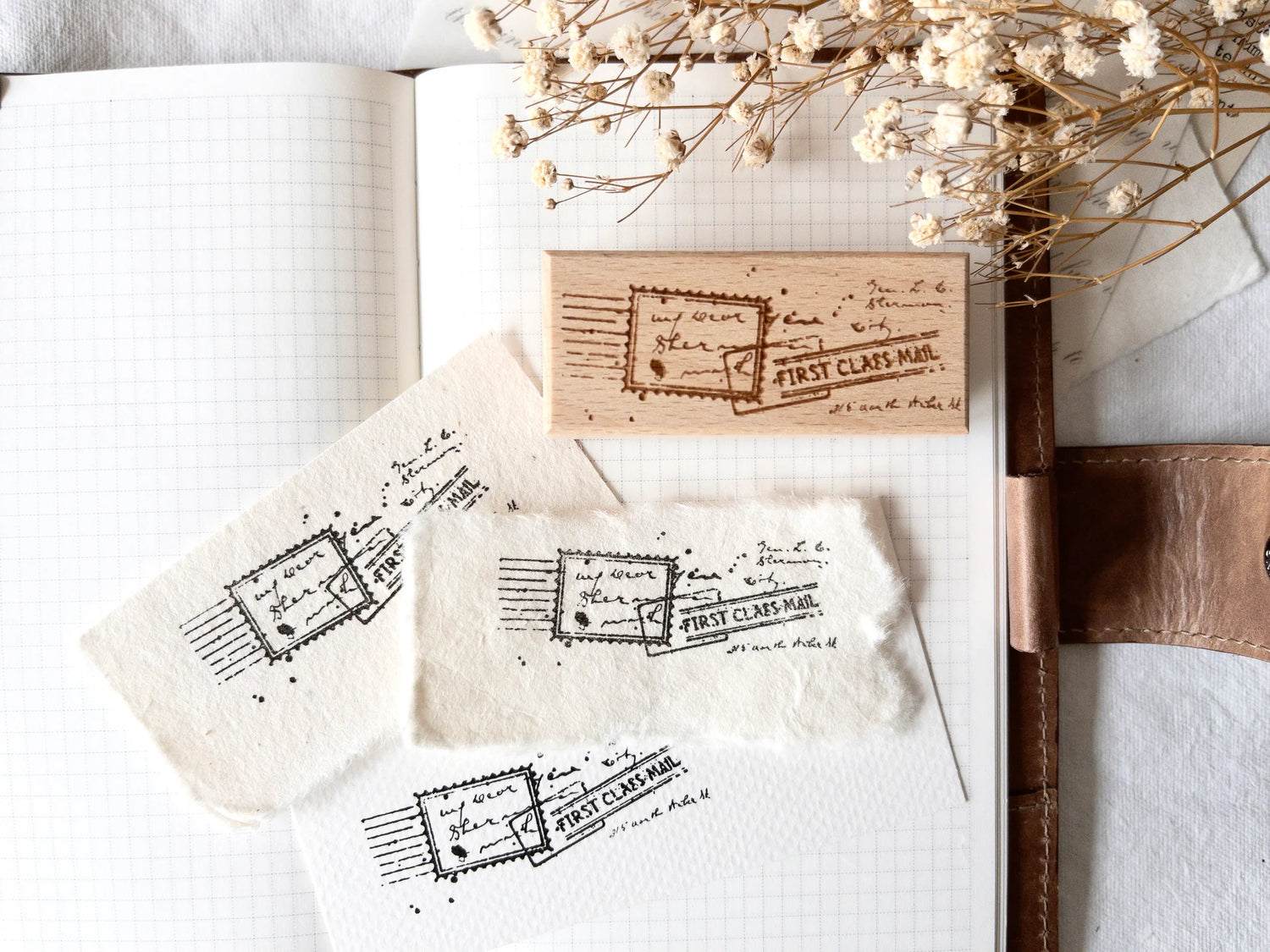 Vintage-style wood stamp with a distressed-look first class mail design