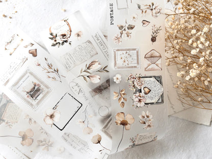 Collection of decorative stickers with floral and vintage designs on a light background.