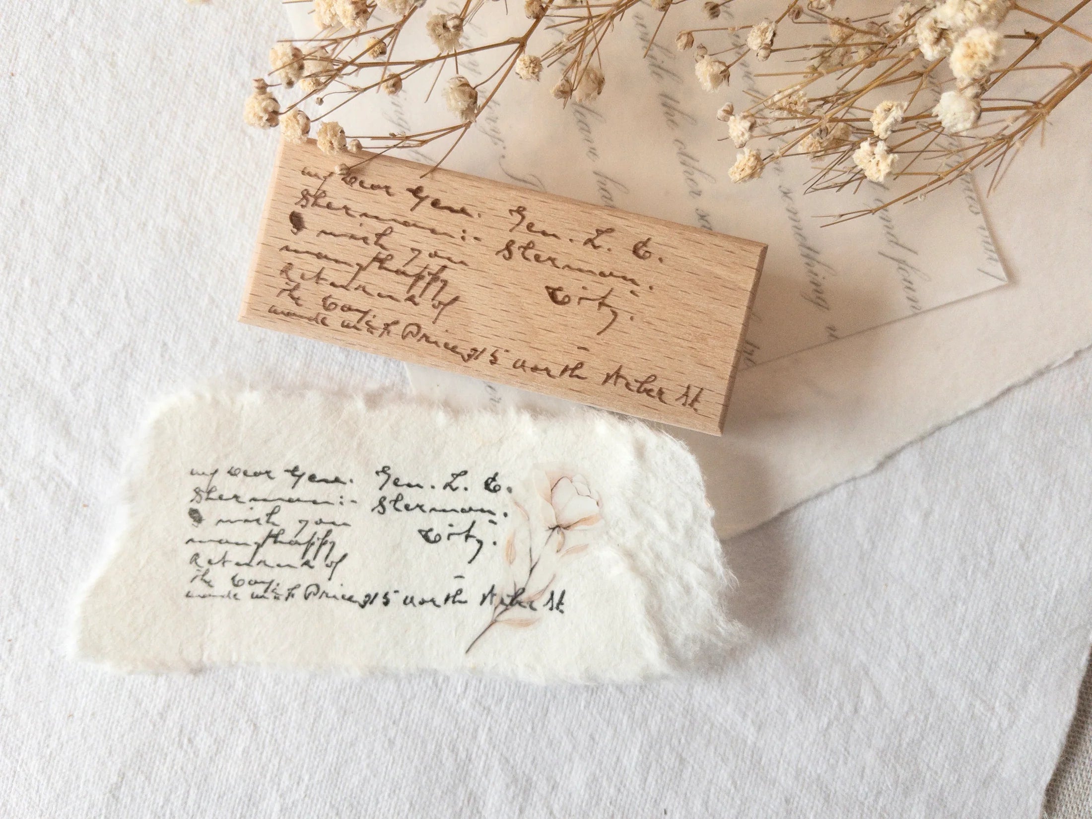 Wood-mounted stamp with vintage script text