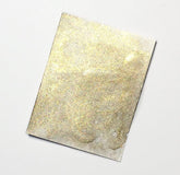 Sheet of gold paper on a white background