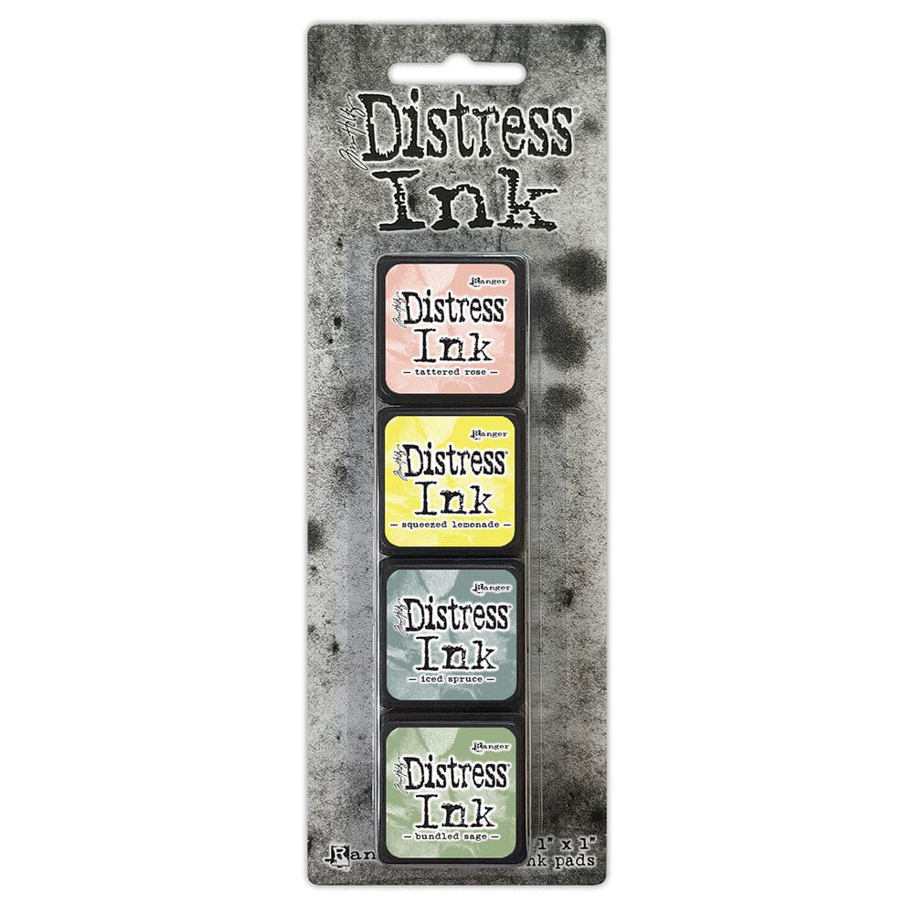 Packaging of Distress Ink with four ink pads on a textured gray background