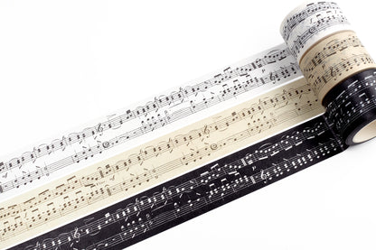 Three rolls of washi tape with musical note designs on a white background