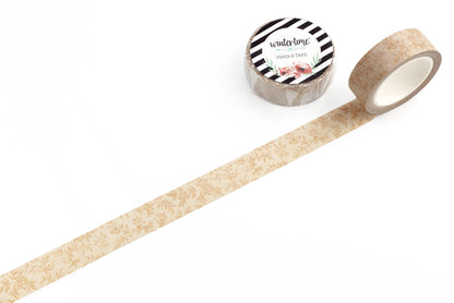 Decorative tape with a beige pattern and a roll of tape with a black and white Wintertime Crafts logo label on a white background.