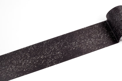 A roll of black tape with a white cursive handwriting, shown partially unrolled on a plain white background.