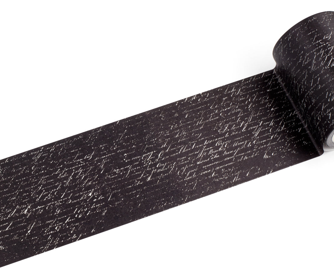 A roll of black tape with a white cursive handwriting, shown partially unrolled on a plain white background.