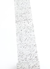 Washi taoe with dense, elegant black cursive handwriting, shown against a plain white background.