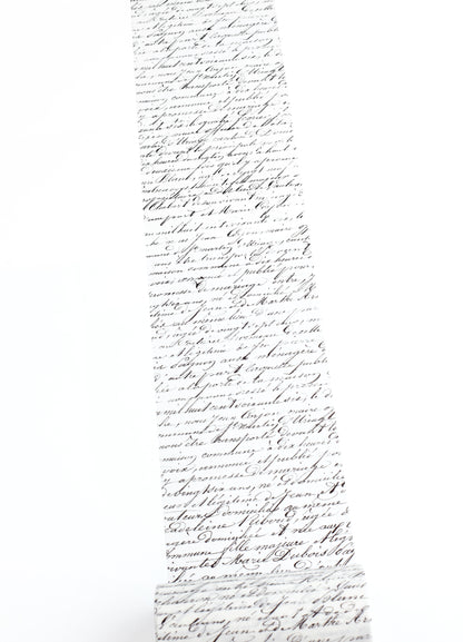 Washi taoe with dense, elegant black cursive handwriting, shown against a plain white background.