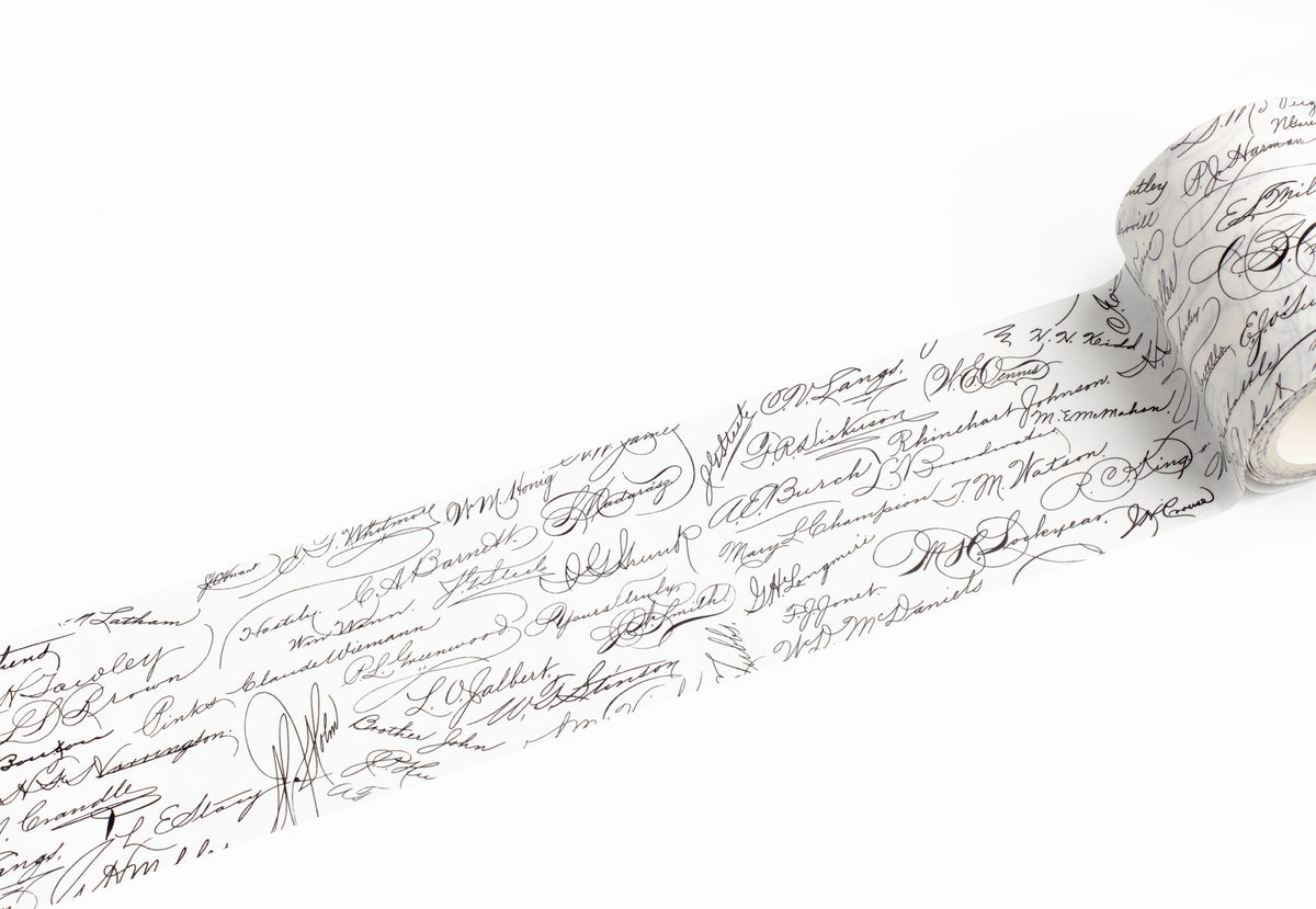 A roll of white adhesive tape featuring a black cursive script pattern, shown partially unrolled on a clean white background.