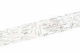 A close-up of a white washi tape covered with many small black handwritten signatures and cursive writing, shown diagonally across the frame.