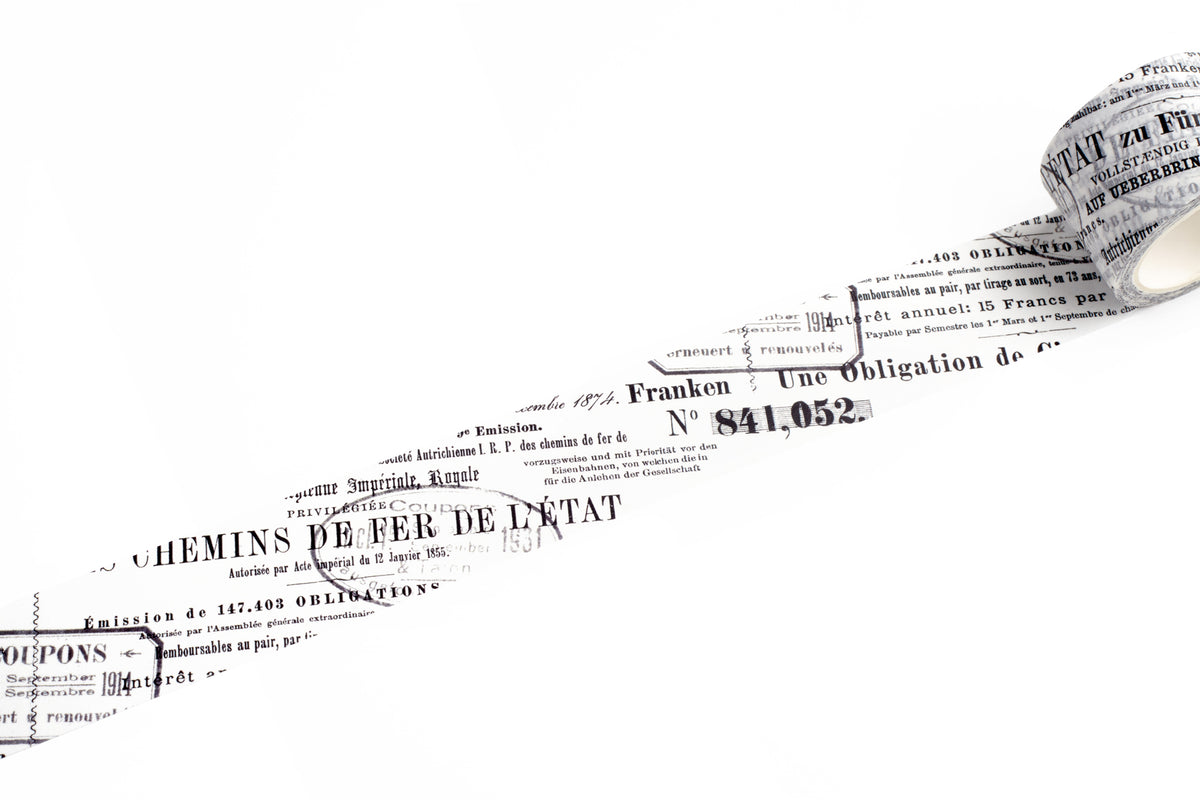 A close-up of a washi tape strip of vintage French railway stamp paper showing printed text and stamps on a plain white background.