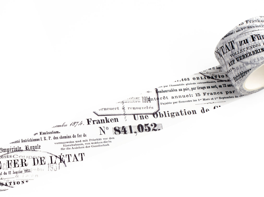 A roll of decorative tape featuring black French text and numbers printed on a white background, shown against a clean white backdrop.