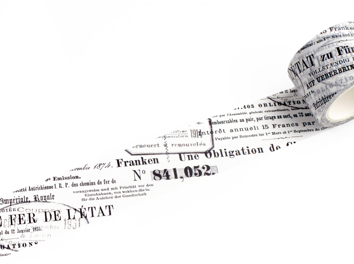 A roll of decorative tape featuring black French text and numbers printed on a white background, shown against a clean white backdrop.