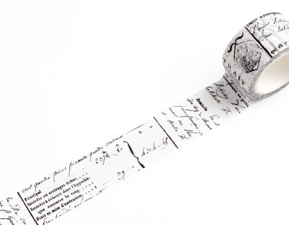 A roll of decorative washi tape with a vintage French script and postmark pattern, partially unrolled on a clean white background.