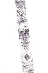 A long washi strip with a repeating black vintage-style ornamental pattern and text, shown against a plain white background.