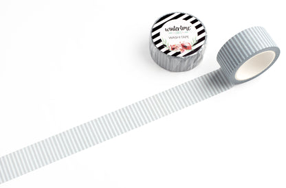 A roll of gray and white striped washi tape shown on a clean white background.