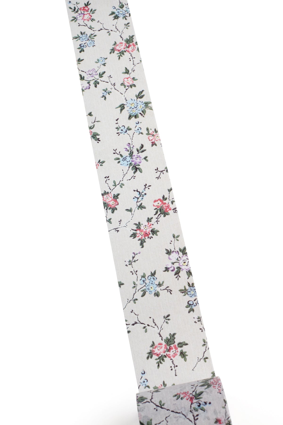 Washi tape with a delicate floral print on a light background, featuring pink, blue, and green flowers with green leaves.