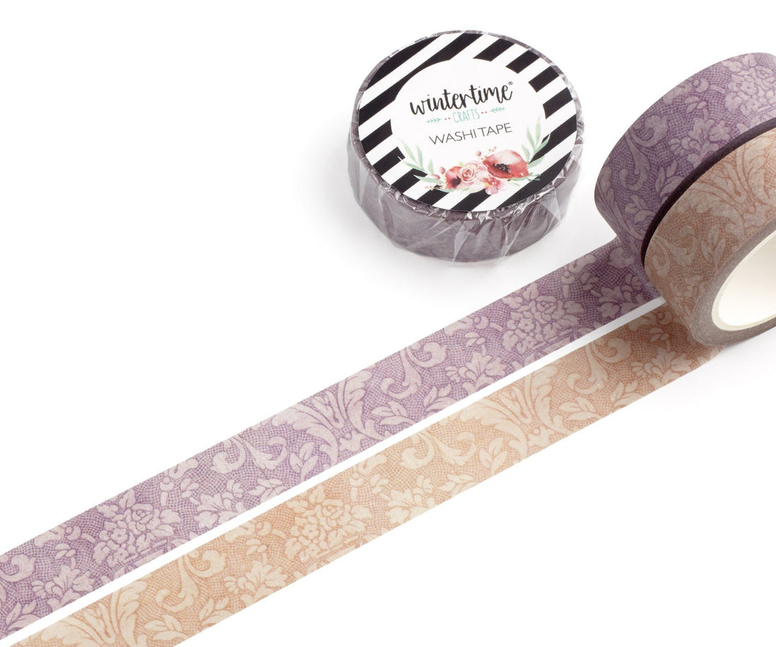 Two rolls of washi tape on a white background, one with a purple damask pattern, another with a beige damask pattern. The label reads &