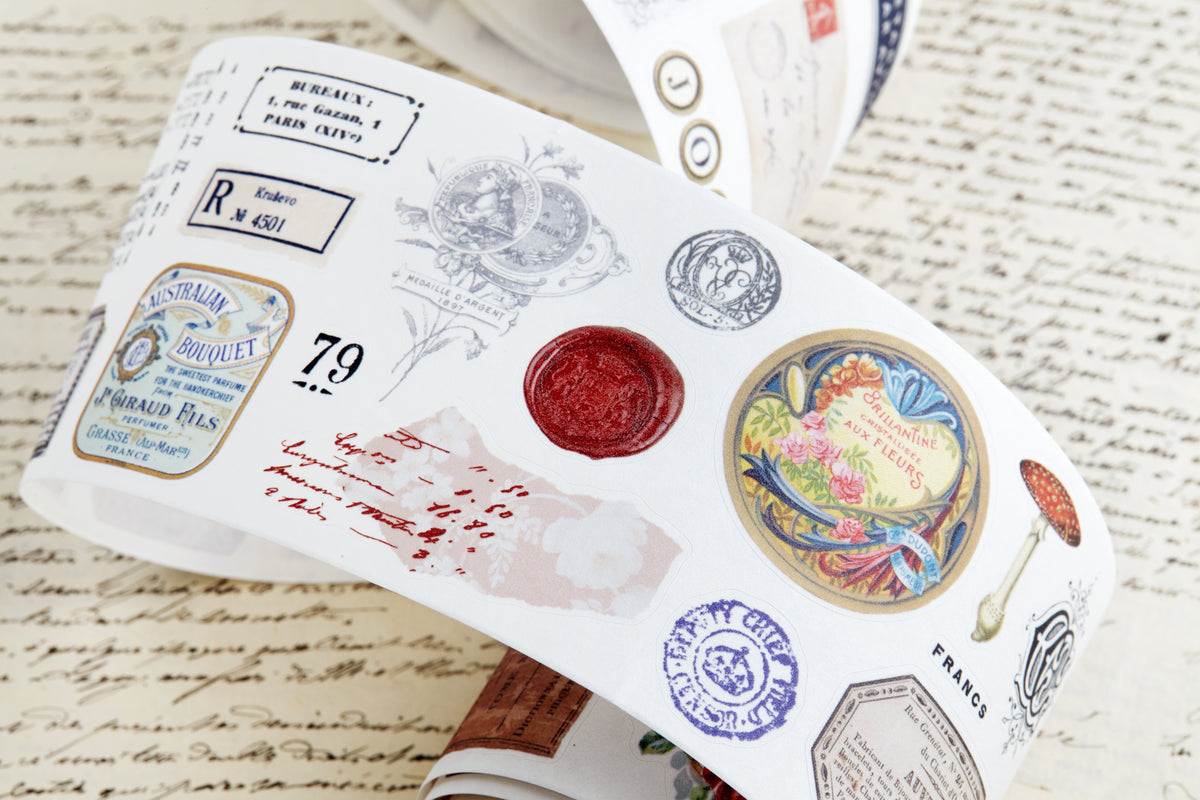 Washi tape with pre-cut vintage-style decorative stickers such as illustrated labels, postage stamps, numbers, and antique typography, laid over a background of old handwritten letters and papers.