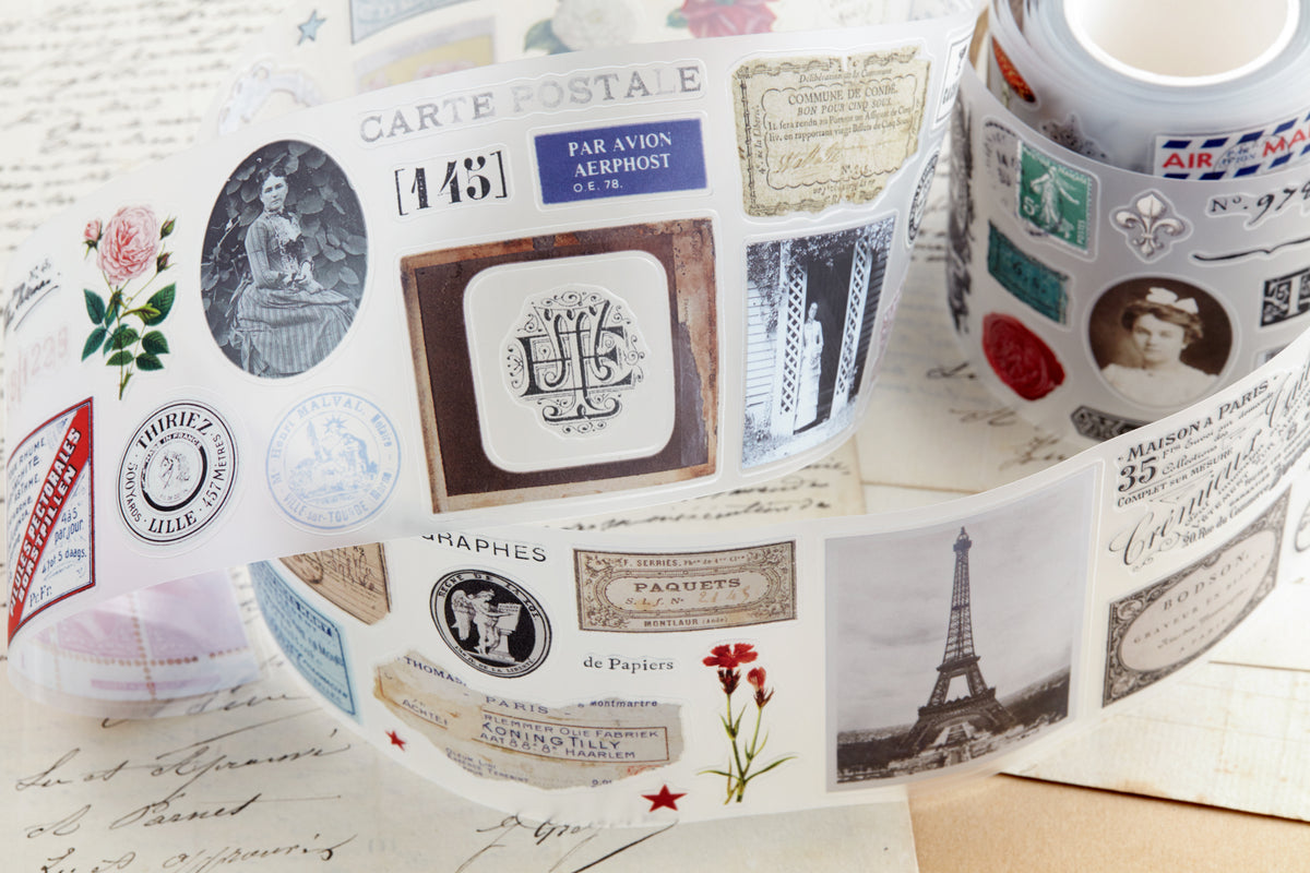 PET tape with pre-cut vintage-style decorative stickers such as illustrated labels, postage stamps, numbers, and antique typography, laid over a background of old handwritten letters and papers.