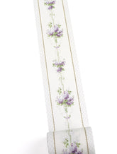 A roll of washi tape featuring a vertical pattern of purple flowers, green leaves, and dotted borders on a white background.