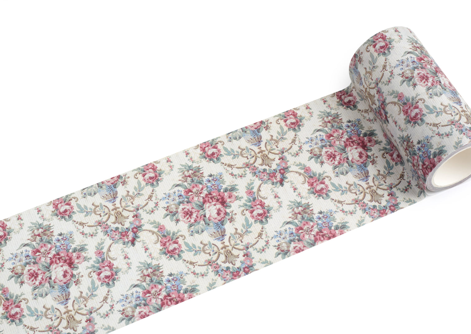 A roll of extra wide vintage-style floral washi tape with a repeating pattern of pink and blue roses, green leaves, and tan scrollwork on a warm off-white background, shown unrolled against a plain white studio background.