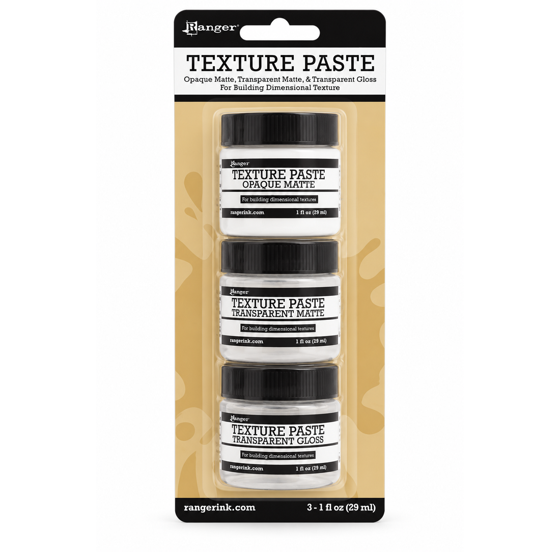 Ranger Texture Paste set of three small jars in clear plastic packaging with a black and tan backing card. The jars are labeled opaque matte, transparent matte, and opaque gloss.
