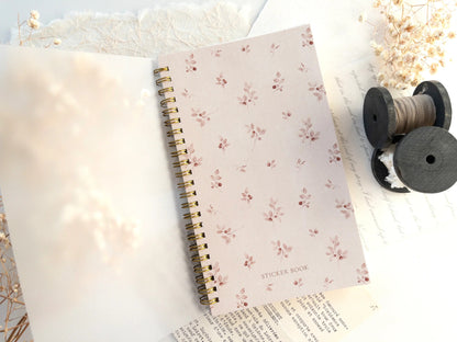Notebook with floral pattern on a soft surface with decorative elements