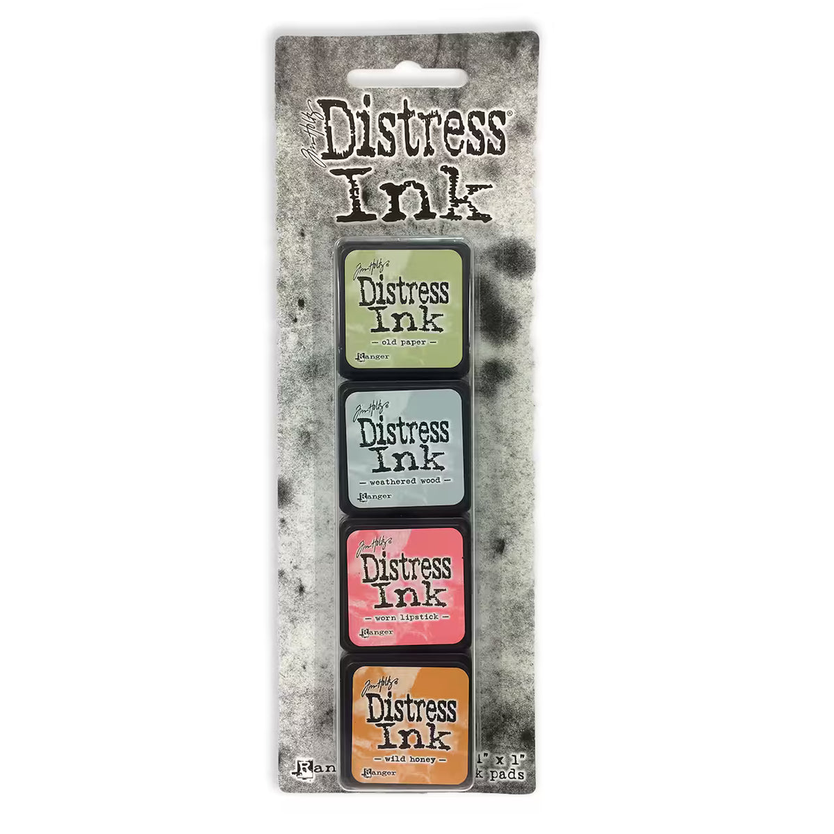 A 4-pack of Tim Holtz Distress Ink pads in assorted colors, packaged on a textured gray cardboard backing with a die-cut hanging slot.