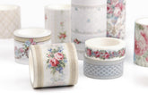 A group of decorative washi tapes with vintage floral and geometric patterns, displayed on a clean white background.