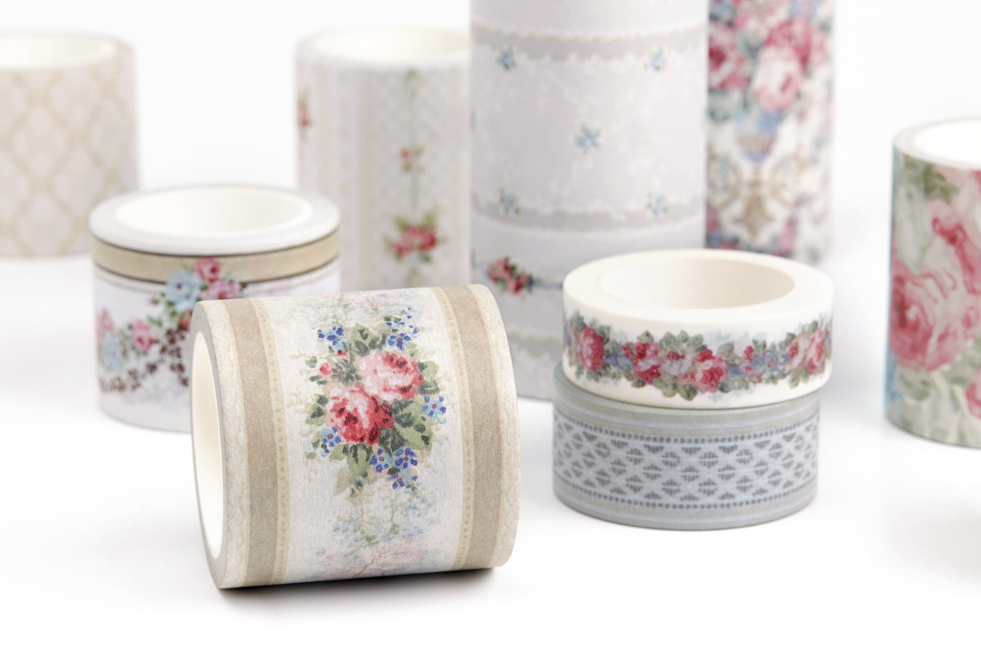 A group of decorative washi tapes with vintage floral and geometric patterns, displayed on a clean white background.